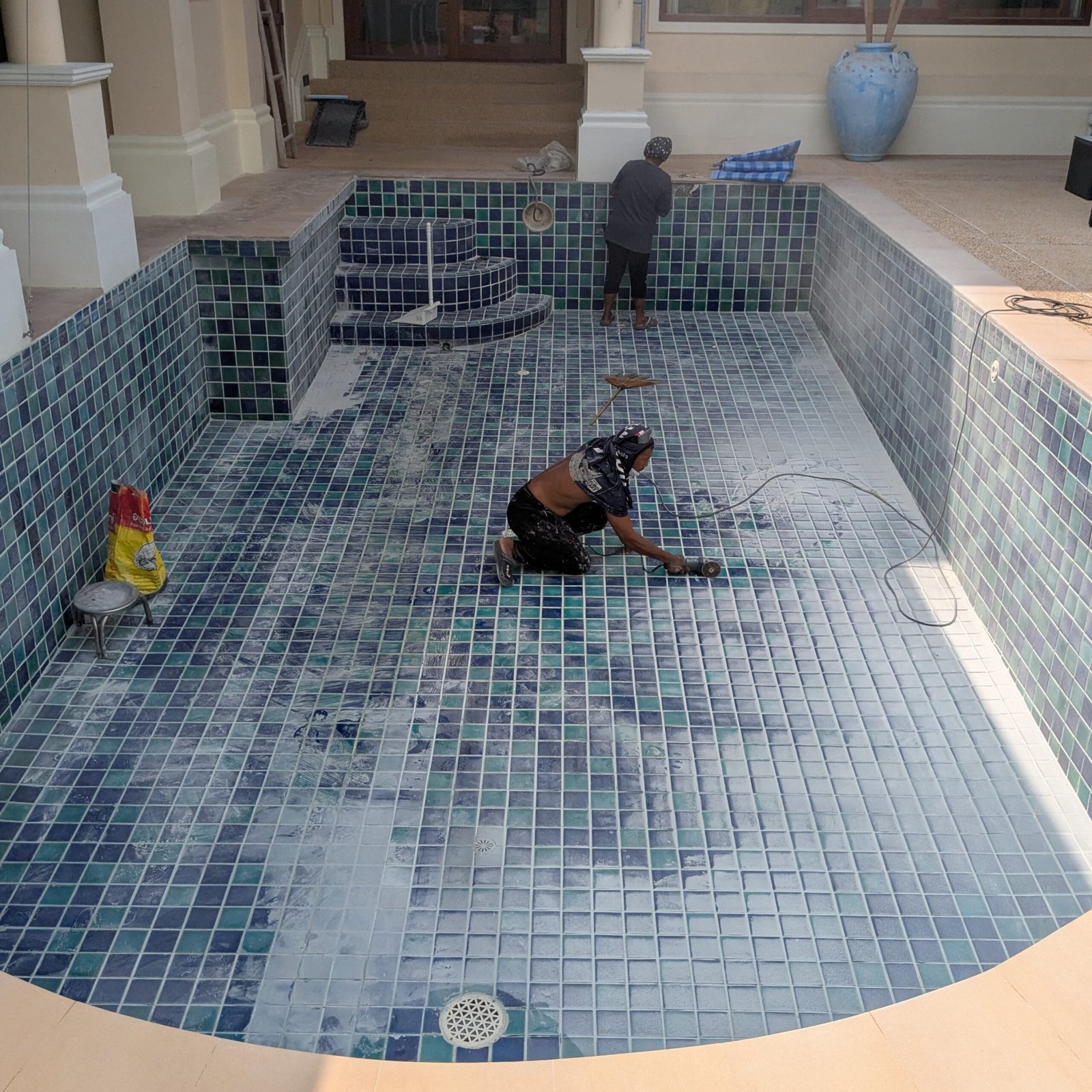 Pool tile removal and surface preparation before retiling in Phuket