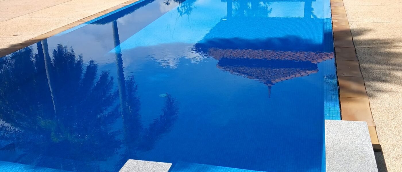 Renovated villa swimming pool with blue mosaic tiles