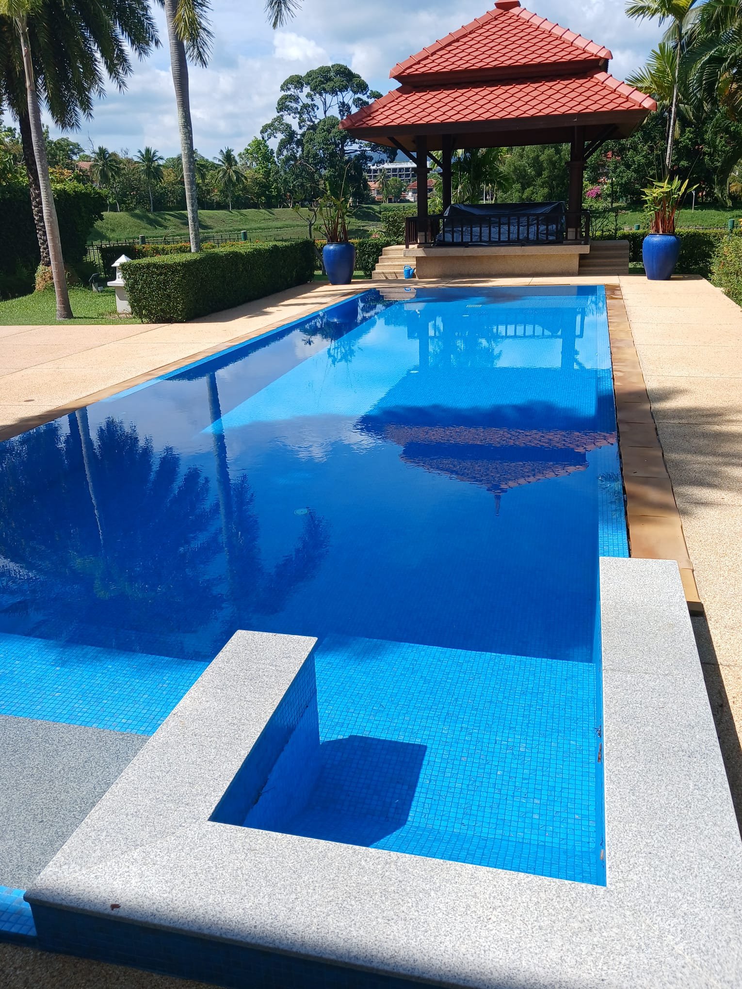 Blue-tiled villa swimming pool with a Thai pavilion in Phuket